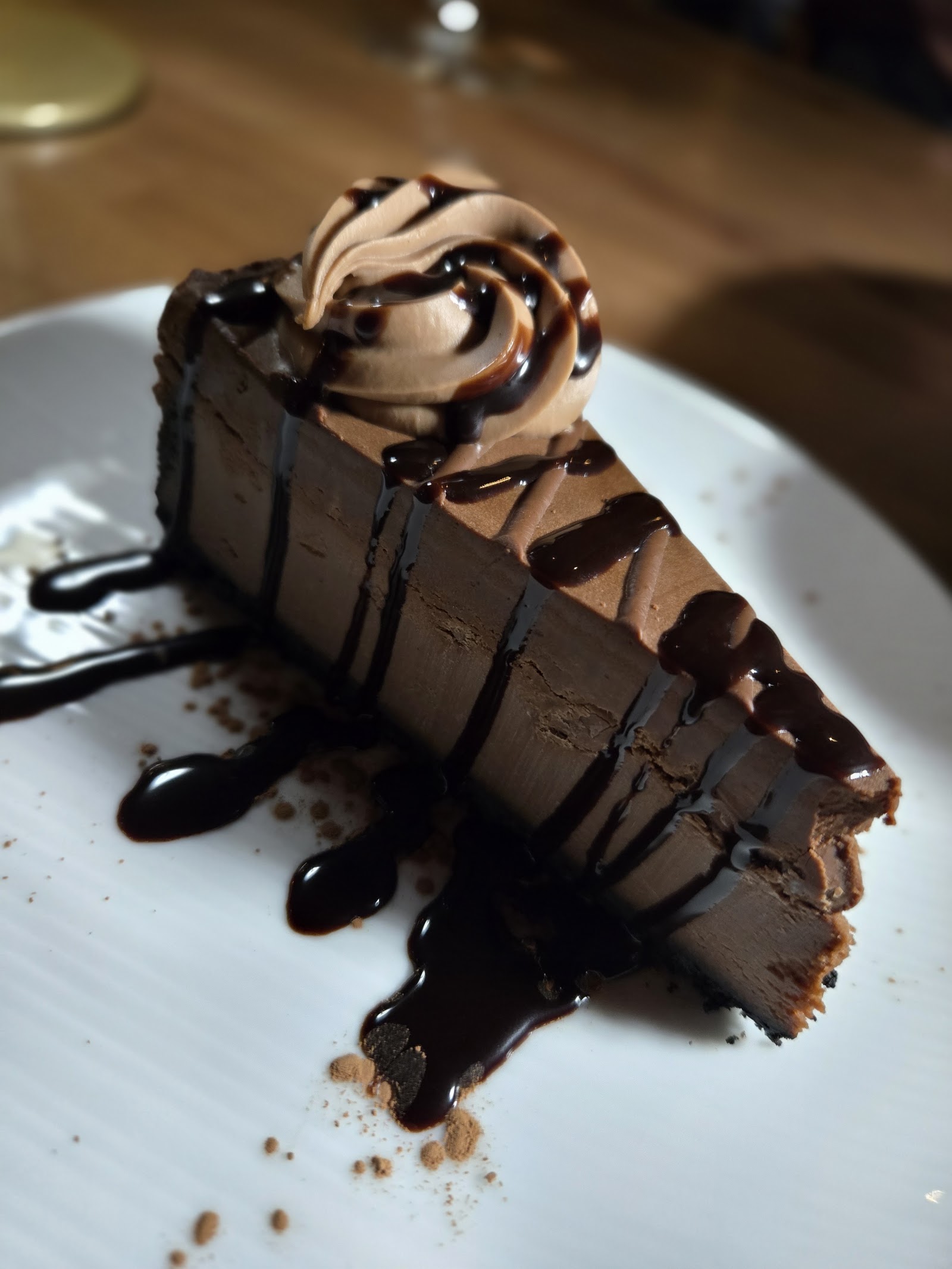 Chocolate ganache cake slice with chocolate drizzle